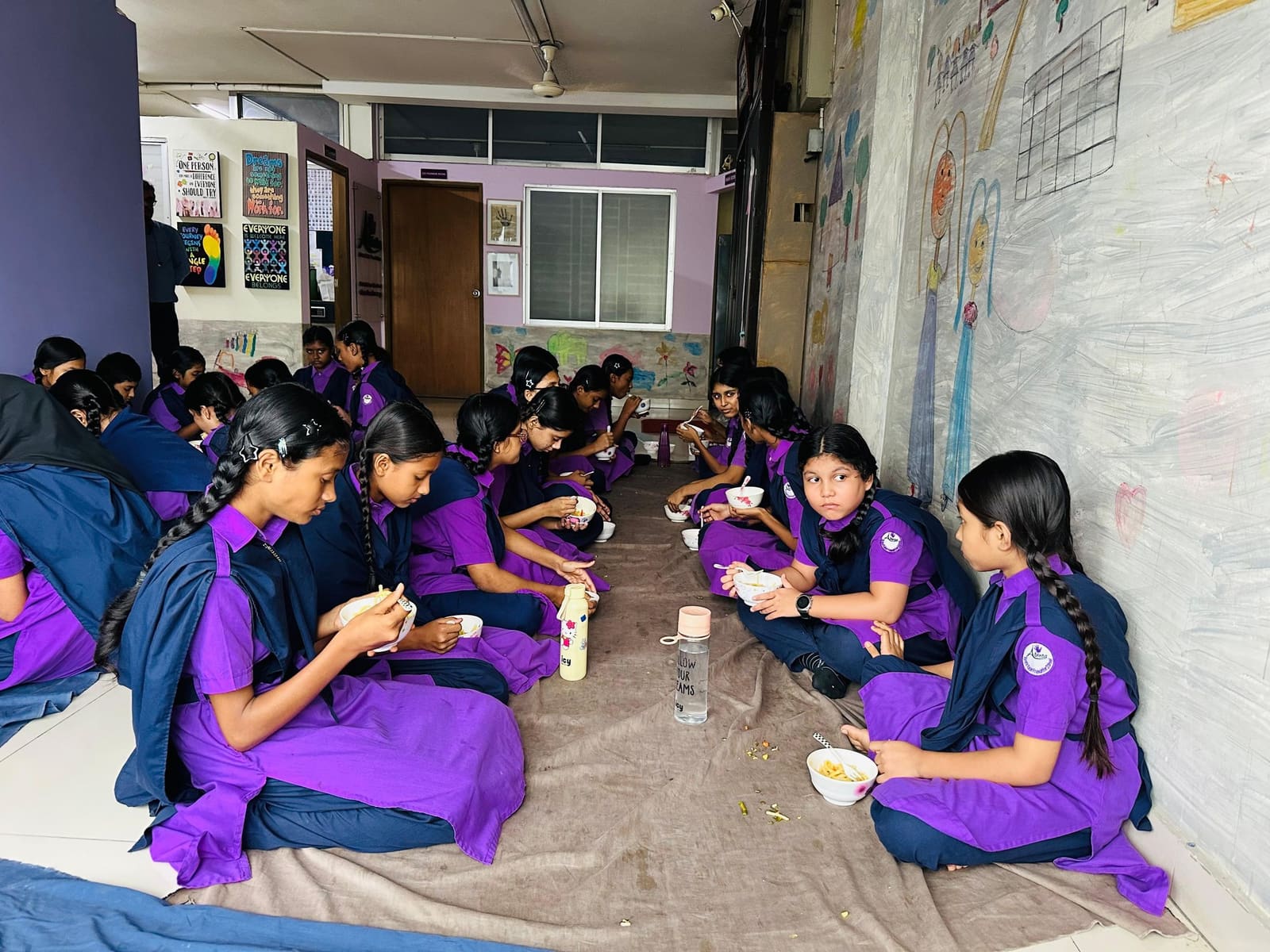 Girls sharing a school meal through a Sidrah Foundation programme in Bangladesh