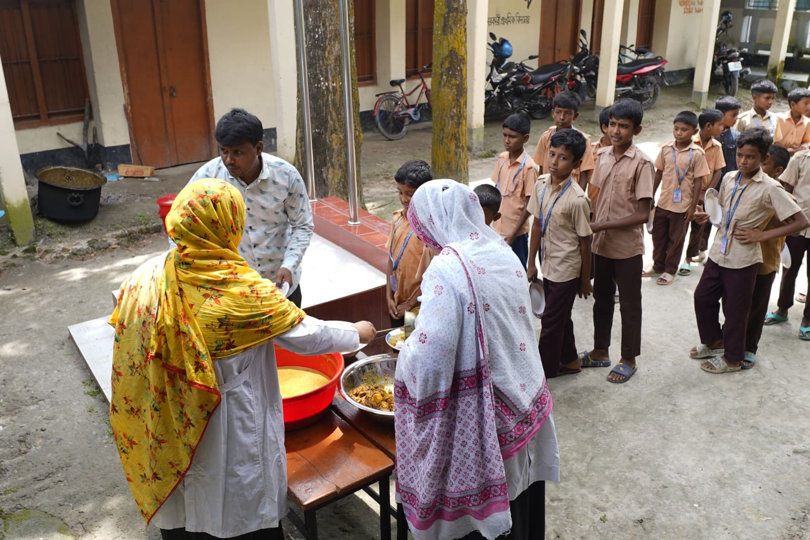 A school meal being served through a Sidrah Foundation programme