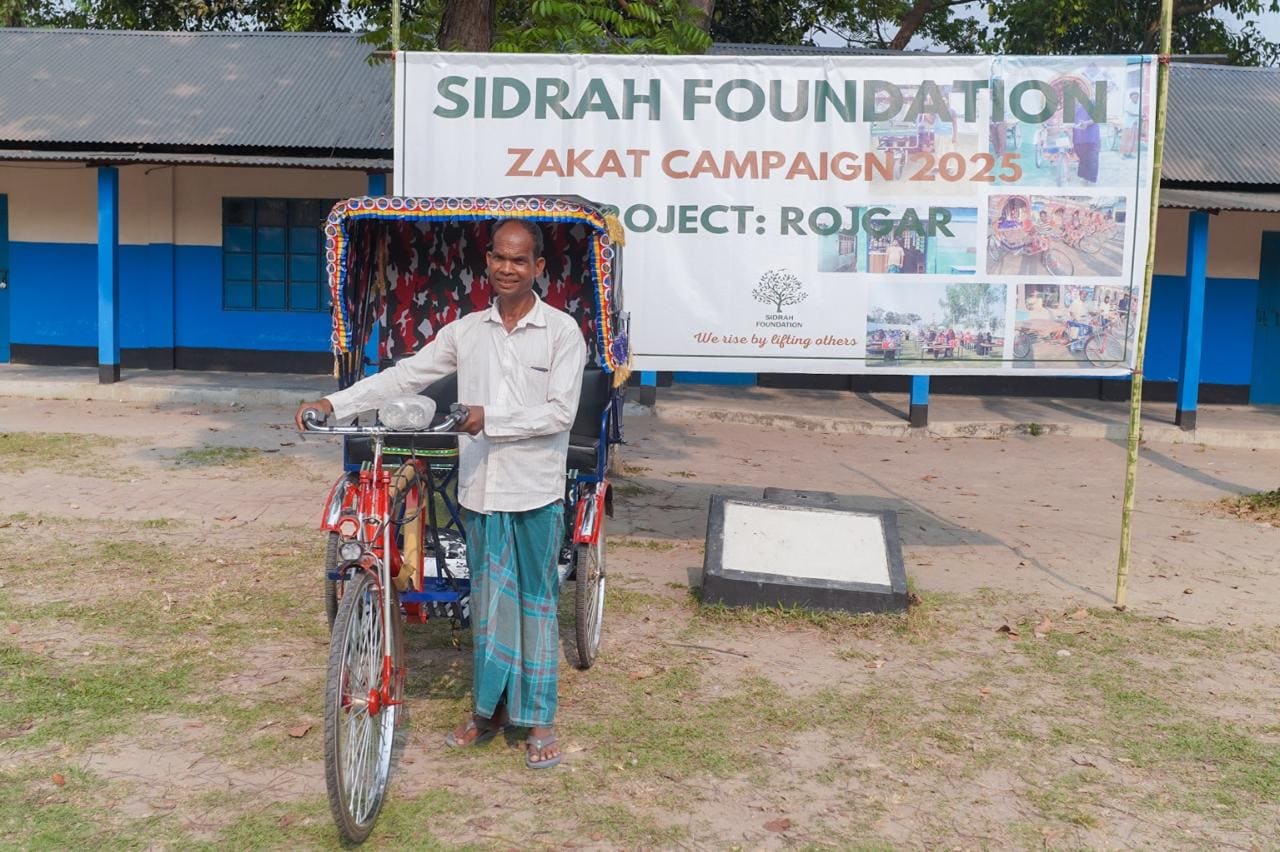 A recipient with a livelihood rickshaw